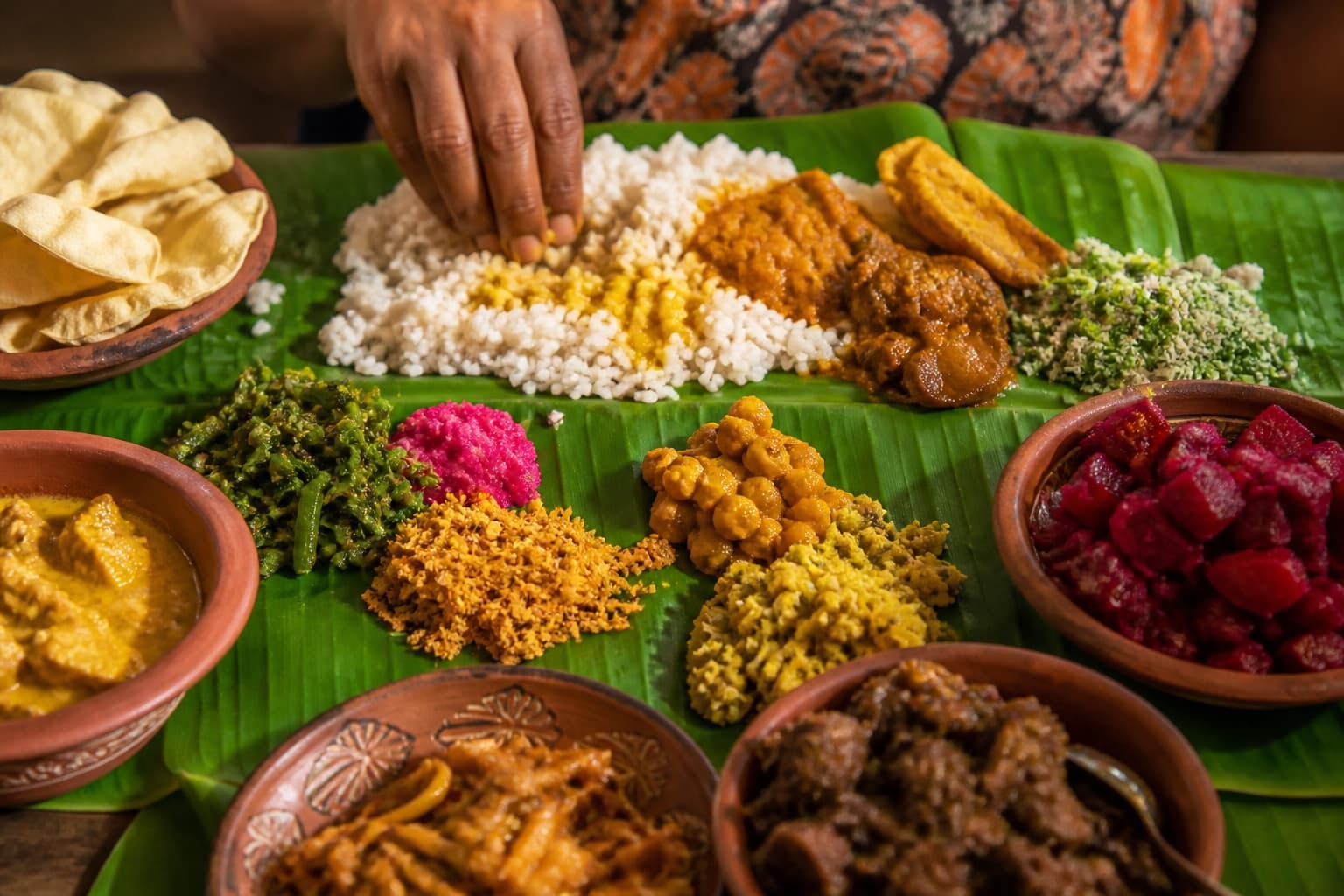 Colourful Sri Lankan rice and curry feast on banana leaf