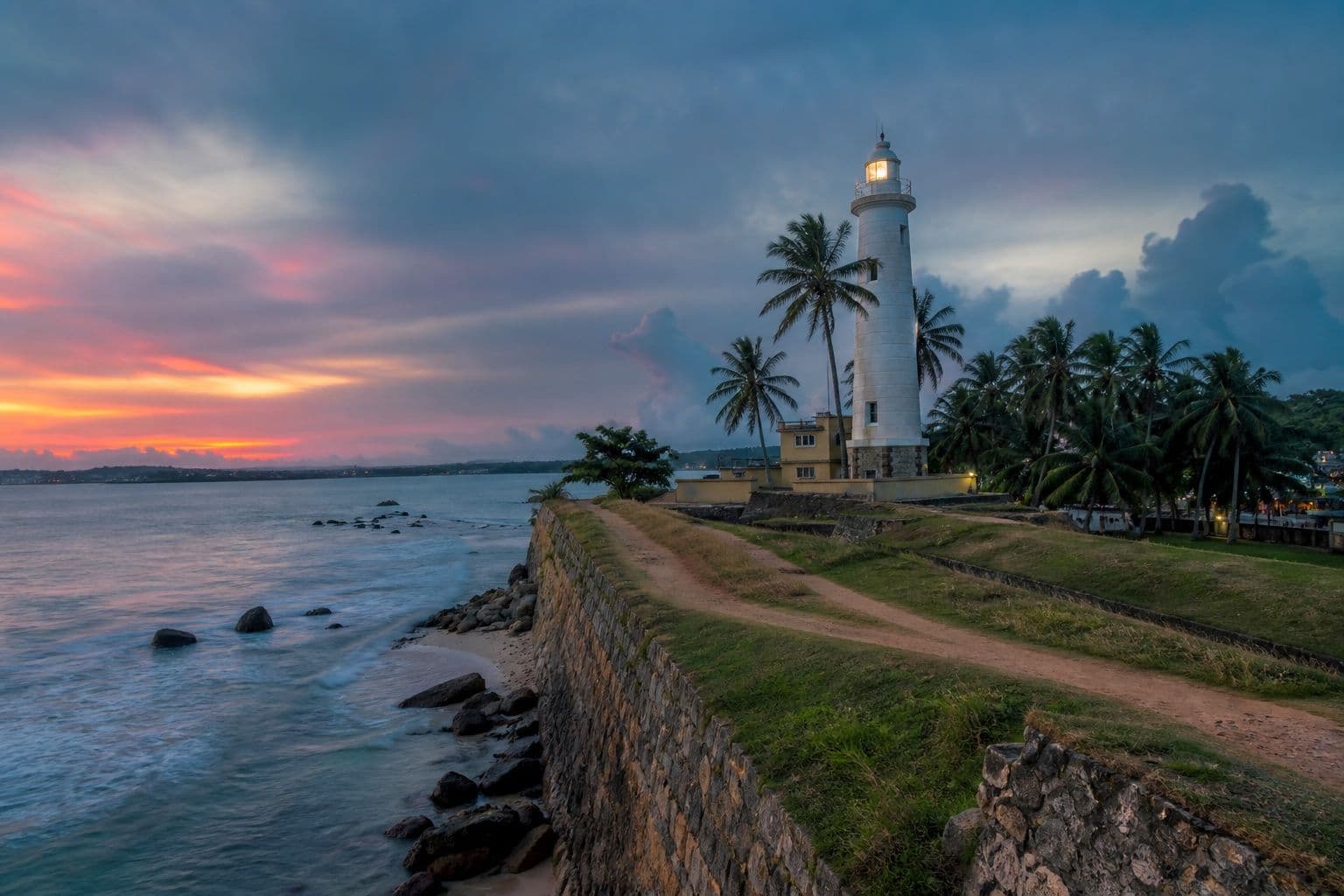 Galle Fort lighthouse and ramparts at twilight
