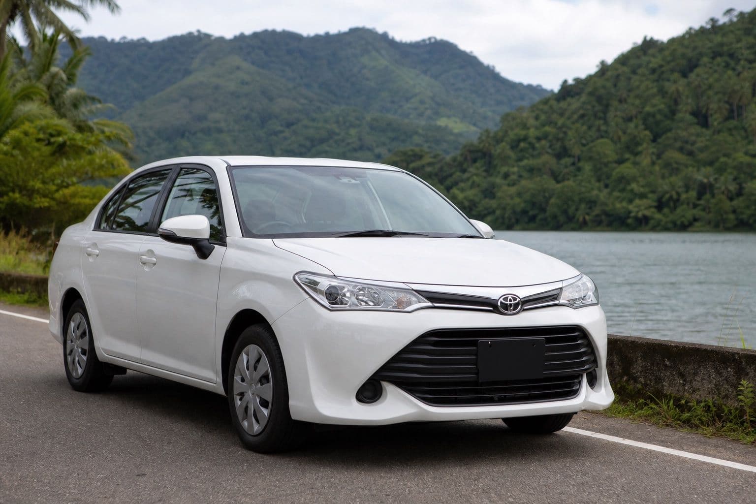 White Toyota Axio sedan for private transfers in Sri Lanka