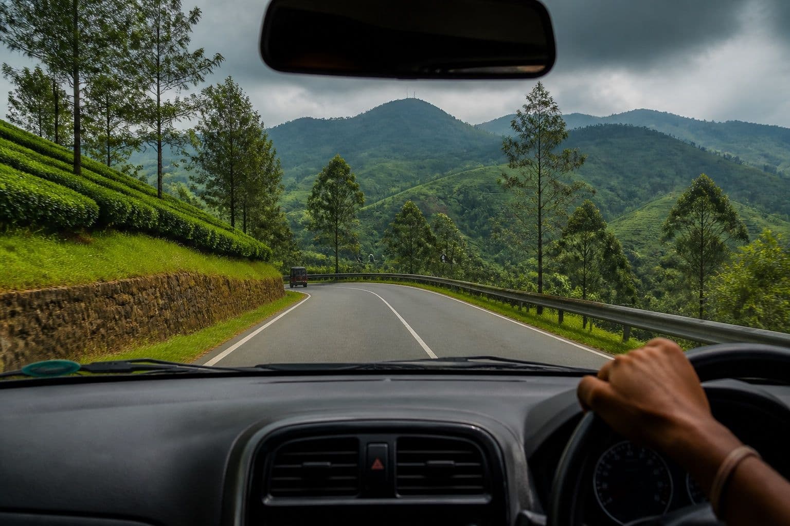 Winding hill-country road through tea estates in Sri Lanka